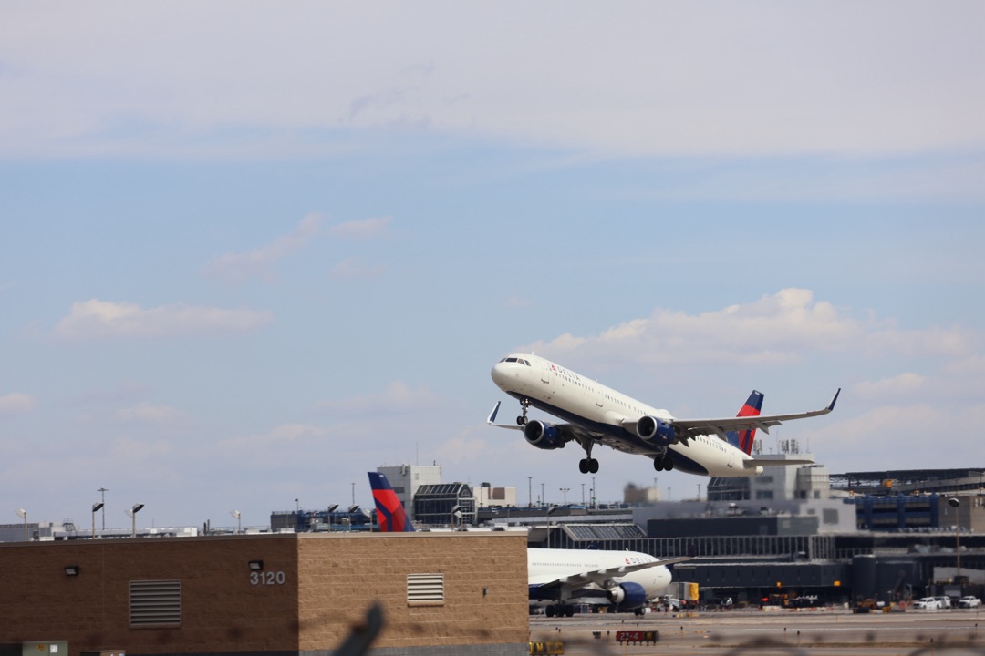 A Delta jet lifting off the runway